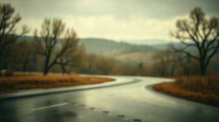 Fototapeta premium Abstract blur of a wet road surrounded by trees with a gloomy atmosphere, perfect for moody or introspective themes.