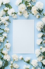 A white blank canvas surrounded by white flowers on a blue background