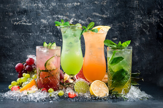 colorful cocktails with ice and fruits copy space