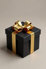 Obraz premium Gold bow on a black gift box wrapped in paper, gift present, fancy wrapping, gold bow