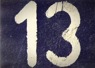 Number 13, White number on a dark background. Black and white old photo