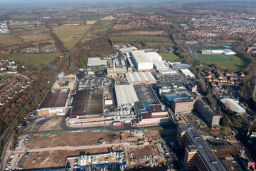 Aerial drone photo of the city of York in North Yorkshire, England showing the large Nestle chocolate factory in the city showing the large building surrounded by houses and homes in the winter time