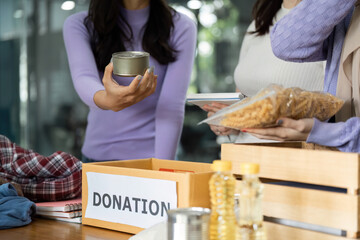 Group of women collecting food donations for community support