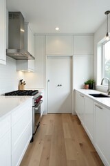 Sleek white cabinets, stainless steel oven, quartz countertops, oven, white kitchen
