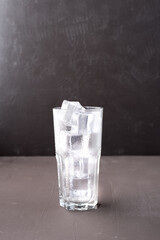 Clear glass with ice cubes..