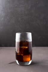 Cold iced coffee in a clear cup.
