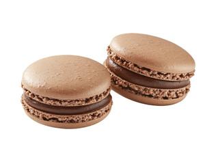 The image presents two chocolate macarons, filled with a chocolate cream in a close up studio shot.