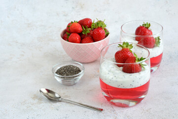 Strawberry Yogurt Parfait with a bowl of berries and a bowl of chia seeds