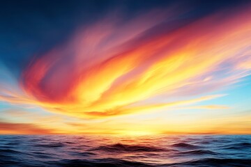 Fototapeta premium Intense fiery sunset with swirling cloud formations reflecting over ocean waves capturing natures power and dynamic weather patterns in an awe inspiring natural spectacle