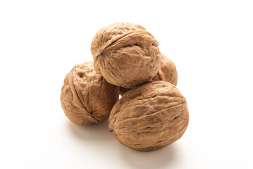 Heap of walnuts fruits on white background