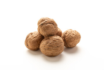 Heap of walnuts fruits on white background