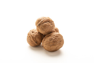 Heap of walnuts fruits on white background
