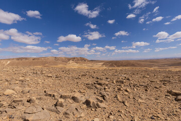 travel through the sandy desert, blue sky and many clouds