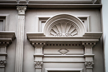 Architectural Detail of Ornate Carved Stone Wall with Decorative Trim