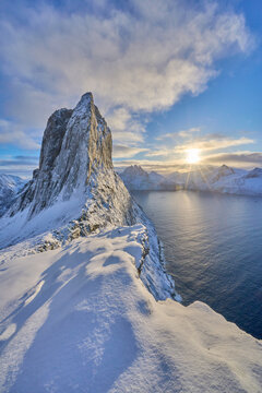 icy winter landscape of the snowy Segla summit near Fjordgard, the most famous mountain  on Senja Island in northern Norway