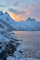moody winter landscape of the Bergsbotn Bay,  part of the Northfjord on Senja Island, in Northern...