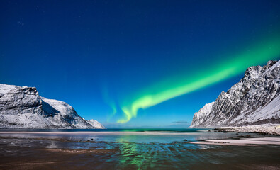 landscape with awesome polar lights in the Ersfjorden on Senja Island in northern Norway