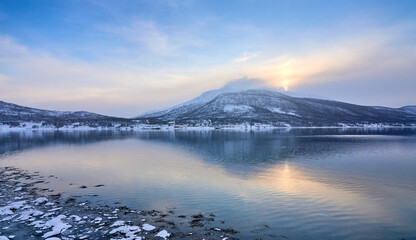 moody coastal winter landscape  near Gibostad  on Senja Island in northern Norway
