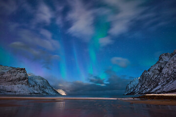 landscape with awesome polar lights in the Ersfjorden on Senja Island in northern Norway