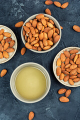 Almond oil with shelled almond nuts.