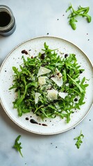 Vibrant arugula salad with parmesan and balsamic dressing on a rustic plate