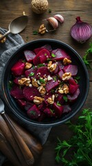Colorful beet salad with walnuts and fresh herbs in a rustic bowl