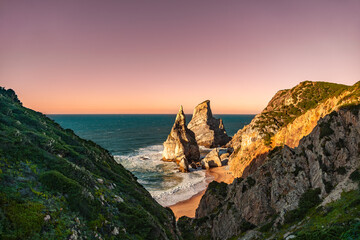 Wide View from Trail Overlooking Ursa Beach and Rocha da Ursa Rock Formation at Sunset, Portugal