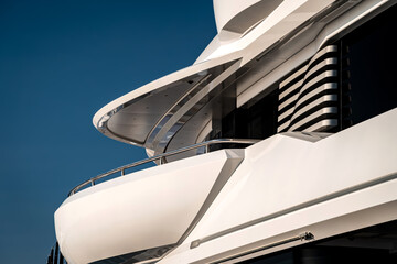 Architectural and nautical design detail of a large superyacht at dock in Genova, Italy
