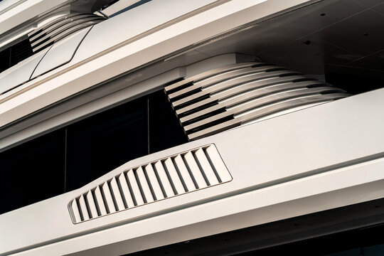 Architectural and nautical design detail of a large superyacht at dock in Genova, Italy