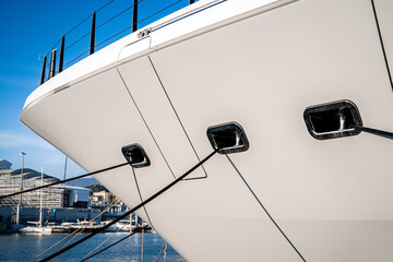 Architectural and nautical design detail of a large superyacht at dock in Genova, Italy