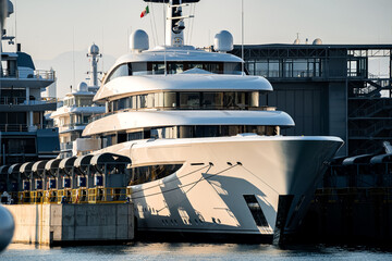 Black and white image of large megayacht or superyacht in large Shipyard located in Genova, Italy,...