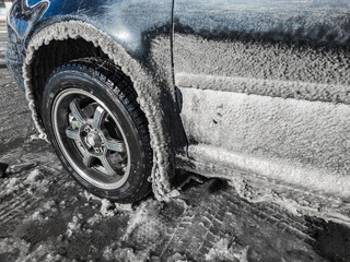Icicles Are Forming under a Car wheel arch Harsh Winter Conditions and Cold Environments