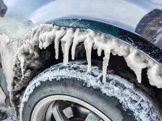 Icicles Are Forming under a Car wheel arch Harsh Winter Conditions and Cold Environments