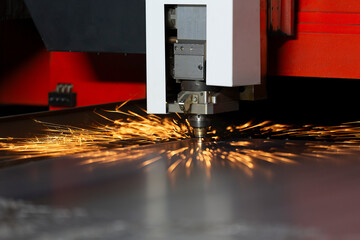 CNC machine works on metal and flame sparks come out