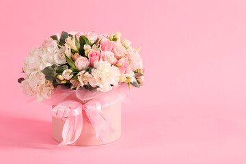 Bouquet of beautiful flowers on pink background, space for text