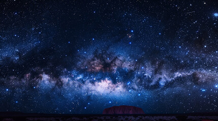 Fototapeta premium Milky Way over Uluru-Kata Tjuta National Park, Australia, iconic monolith