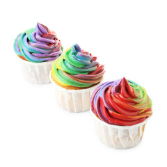 Delicious cupcakes with colorful cream isolated on white
