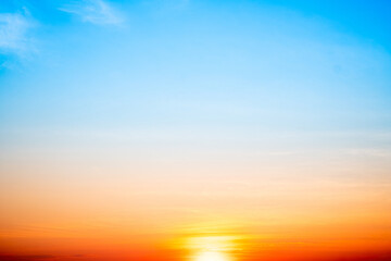 Sky,sunset, beautiful , luxury soft gradient orange gold clouds and sunlight on the blue sky perfect for the background, Sunrise on morning or evening in winter warm time ,Twilight summer,silhouette