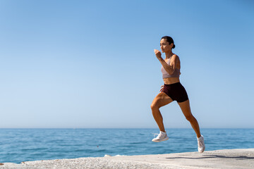 Running along the Seaside in the Morning Light