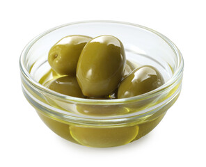 Delicious marinated green olives in bowl isolated on white