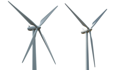 Wind Turbines Duo Against Cloudless Sky Representing Sustainable Power Generation