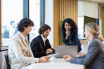 African woman sale manager is showing annual report chart to her colleagues in the executive meeting for next year plan with market share increase for global business and investment concept