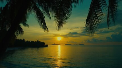 Fototapeta premium Tropical Beach Sunset with Palm Trees Silhouettes and Golden Water