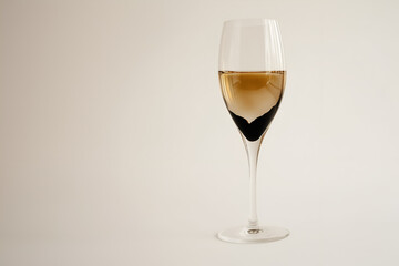 Wine splashing in glass isolated on white background.