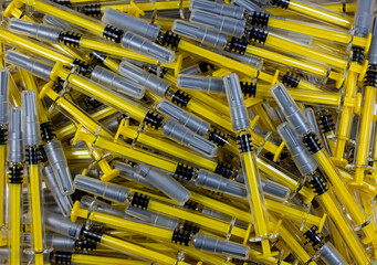 Background with many used syringes, medical waste © sebi_2569