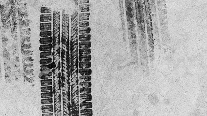 Black tire marks on road, Black rubber tire marks and tread marks, Tire trace track wheels texture and background, Auto tire tread grunge, Car wheel tyre tread track black tyre print, Top view.