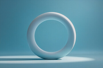 Fototapeta premium White object placed on a blue background creating a simple and clean visual composition
