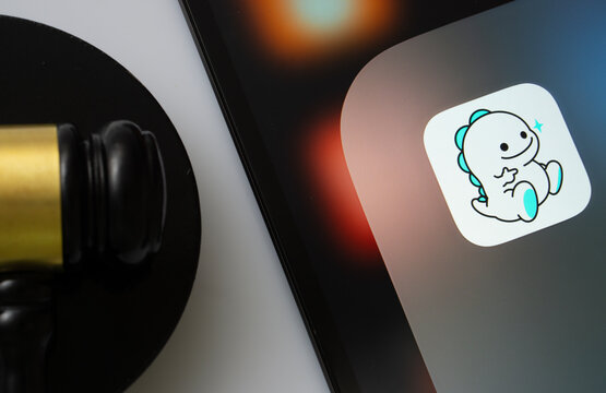 Dhaka, Bangladesh- 01 March 2025: A close up of an iPad screen displaying the bigo live app alongside a judge's gavel.