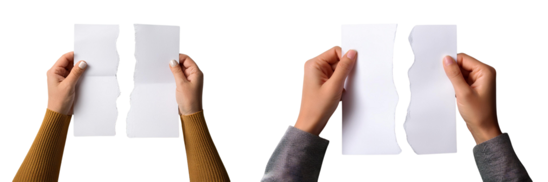     A person tearing a blank sheet of paper, symbolizing change and transformation.