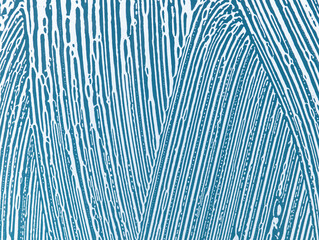 soap foam on window glass, blue background, spring cleaning, abstract pattern